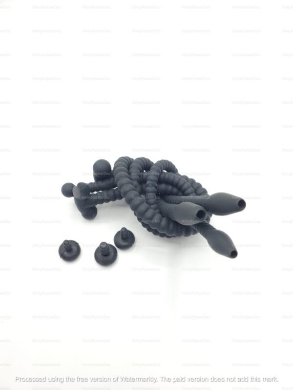 Coiled set of three black silicone hollow urethral catheters with a beaded texture and interchangeable stoppers for secure use.