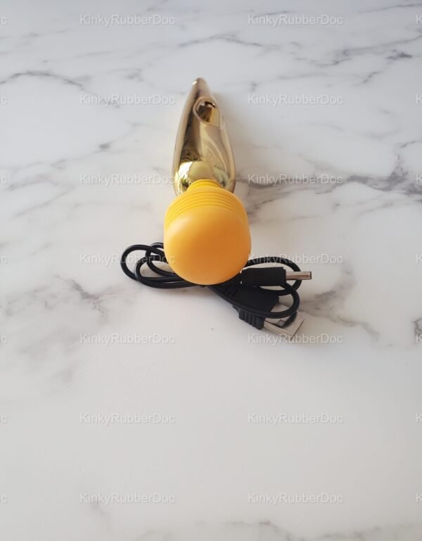 Yellow-head wand vibrator with gold body and USB cable shown from back angle on marble background