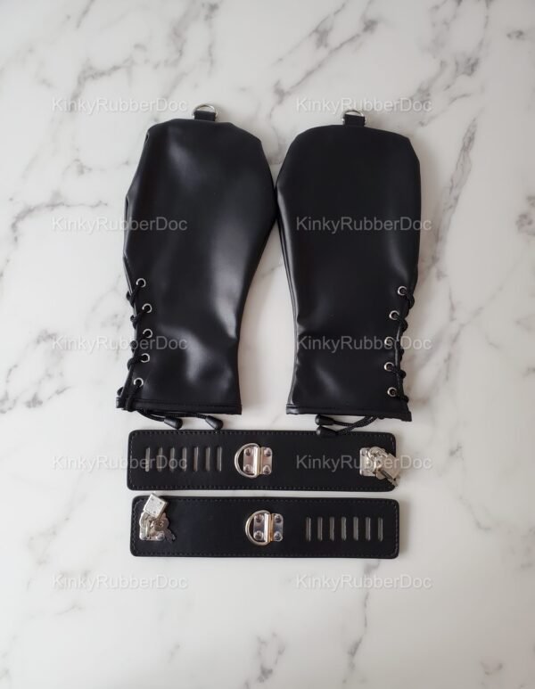 Black Bondage Mitts with Locking Cuffs on a marble background