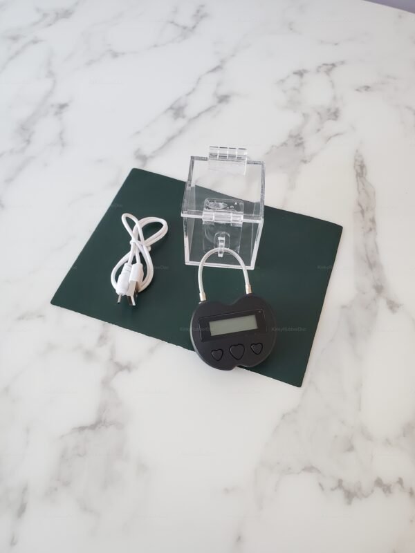 Transparent chastity Timer Key Holder with digital timer lock and USB cable on display