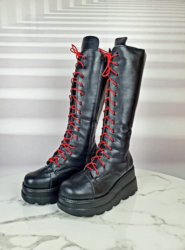 Black platform boots with red laces for a bold, edgy look.