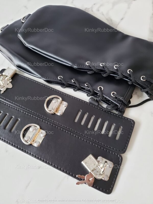 Black leather cuffs and mitts with padlocks and lacing details on a marble surface.