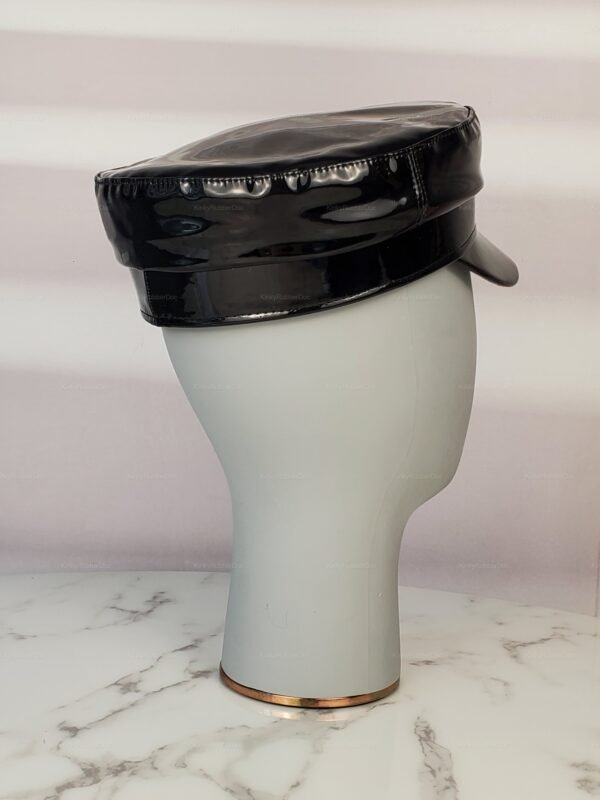 Glossy black wet-look cosplay cap on a marble surface.