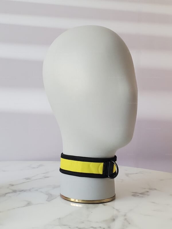 Yellow nylon and neoprene collar with black trim and metal ring for roleplay and fetish fashion.