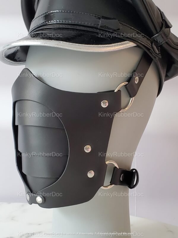Stylish black leather face mask with metal accents and adjustable straps, exuding a bold and edgy vibe.
