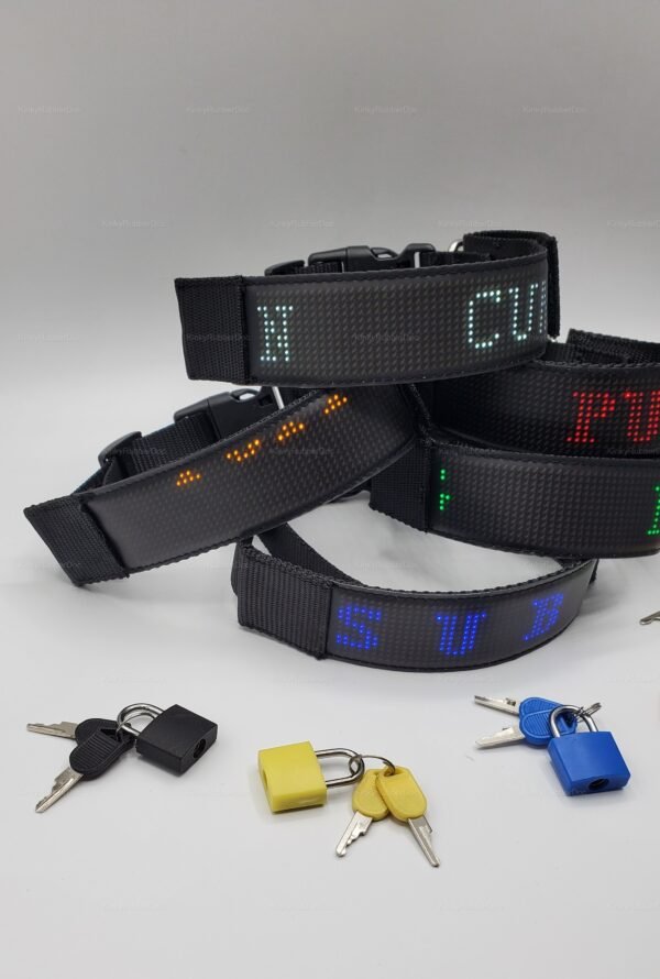 A set of black LED collars with colorful digital displays, accompanied by padlocks and keys.