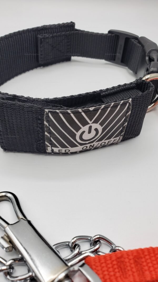 A black LED-programmable collar with a secure padlock, featuring durable material and a sleek design for a bold statement.
