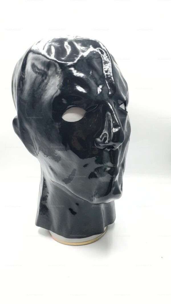Shiny black latex hood with facial features and eye openings.