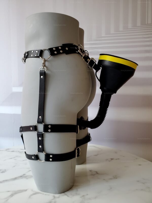 Black leather harness with an attached funnel for adventurous water sports play.