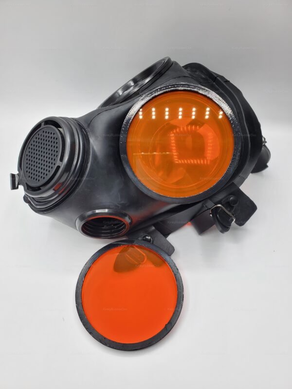 Black gas mask with striking neon orange lens covers, designed for a bold and edgy aesthetic.