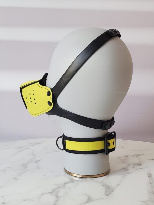 Yellow neoprene muzzle with black straps and D-ring for fetish and pet play.