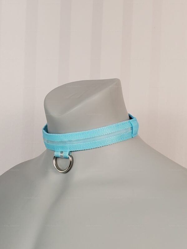 Light blue nylon collar with LED feature and metal D-ring, designed for adult fashion and fetish wear.