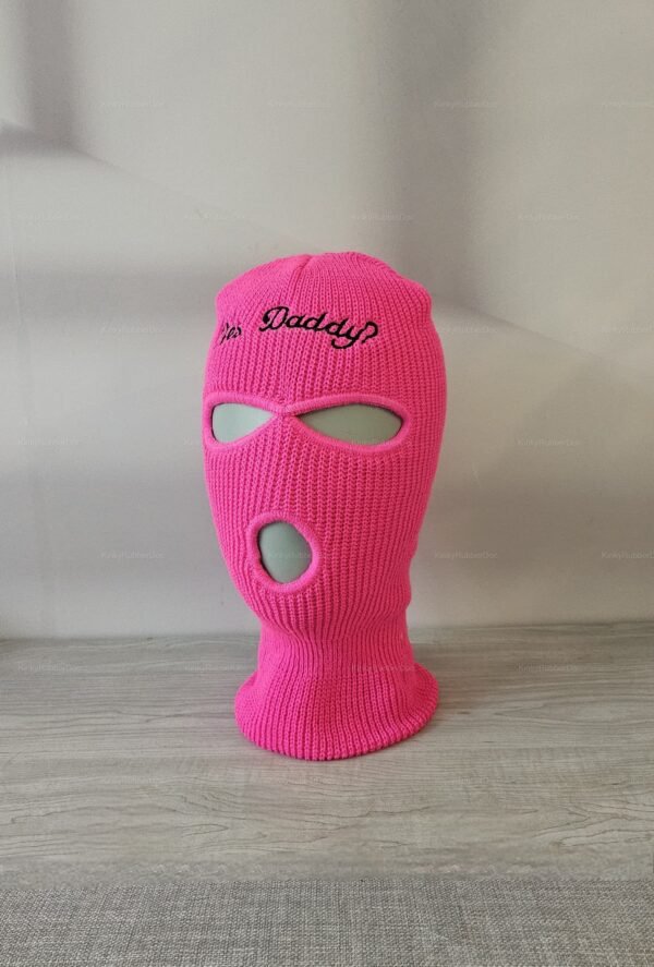 Vibrant pink knit balaclava with "Yes Daddy" script, designed for roleplay.