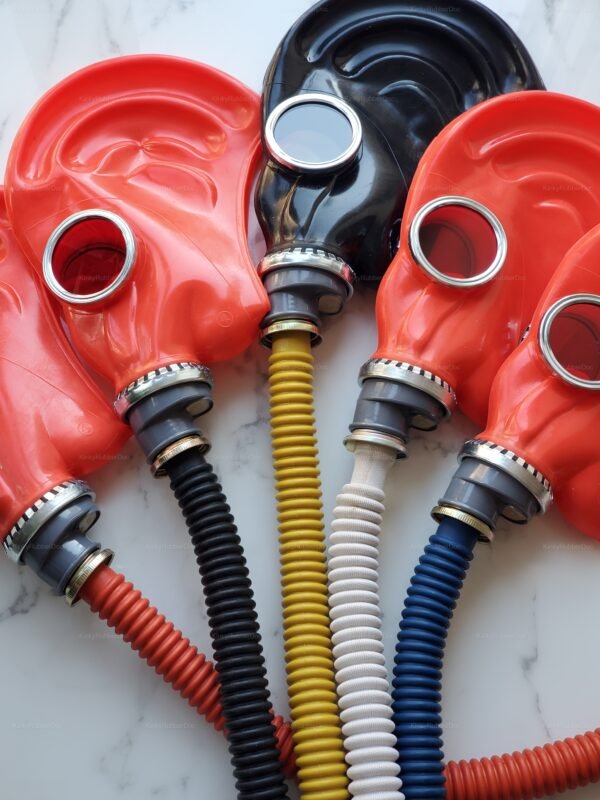 Vibrant red and black gas masks with colorful, flexible hoses.