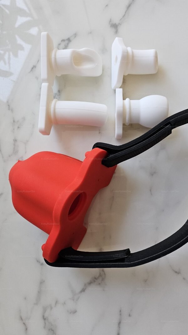 Bold red rubber funnel with interchangeable white silicone attachments on a sleek marble surface.