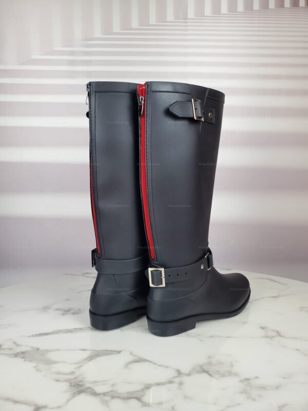 Rubber Boots with Zipper and buckle detail, displayed on a marble surface.