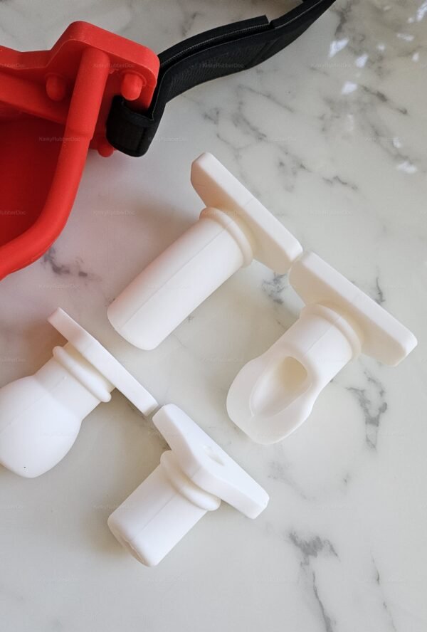Rubber funnel gag set with interchangeable white silicone attachments.