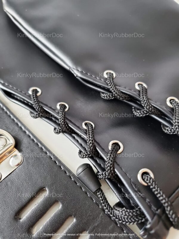 Close-up of sleek black leather cuffs with intricate lace-up design and metal accents.