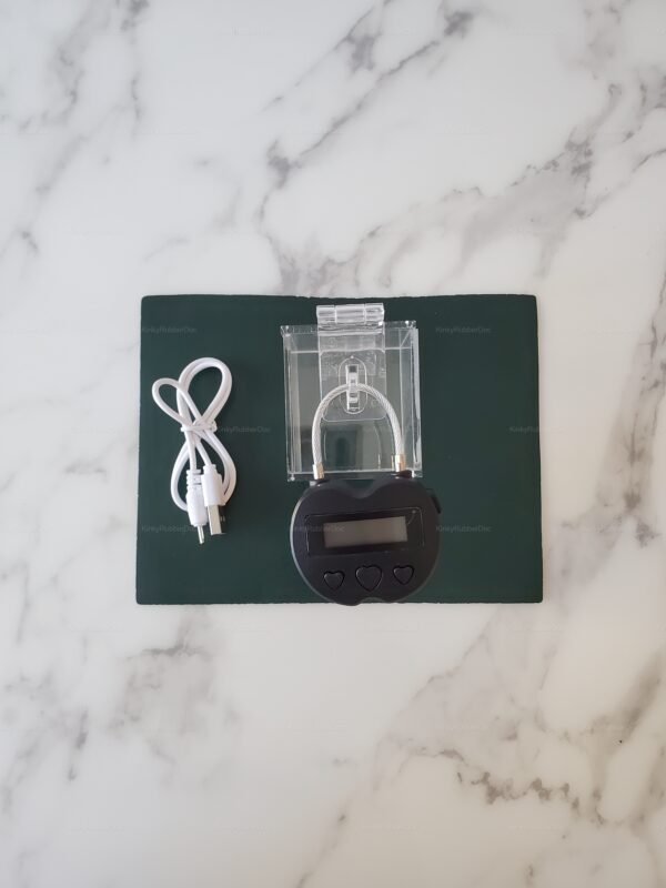 Smart electronic chastity key holder with a sleek design, featuring a clear case and digital lock.