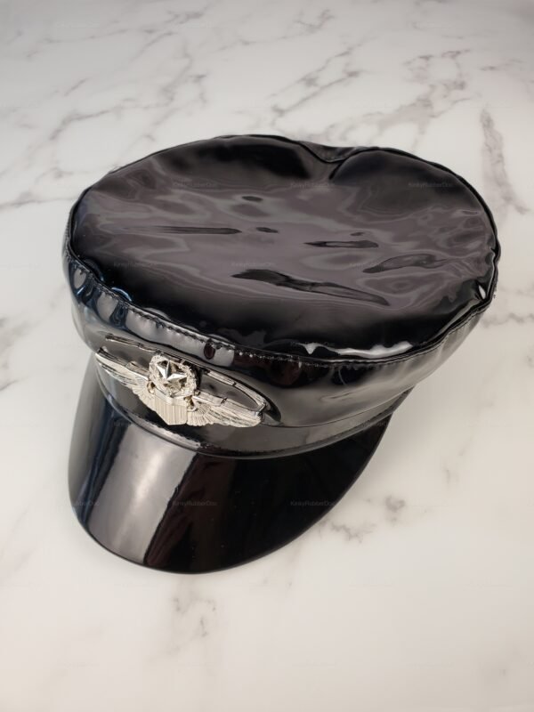 Shiny black military-style cap with a peaked visor and silver emblem.