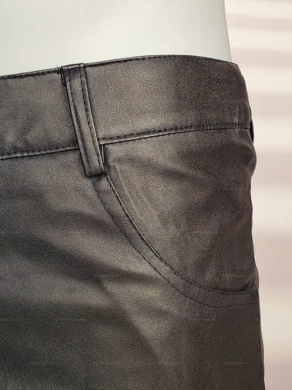 Sleek black leather-look shorts with a textured finish and above-knee length.
