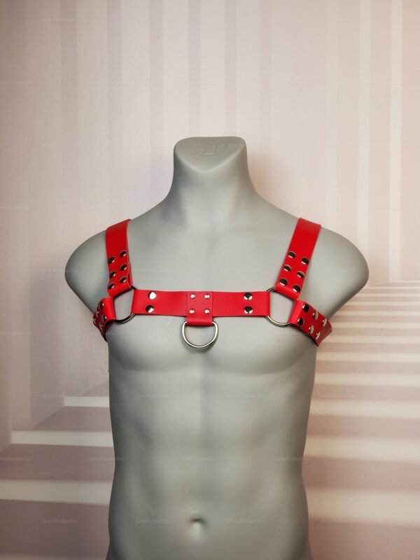 Adjustable red faux leather chest harness with silver D-ring and snap details, LGBTQ+ kinkwear