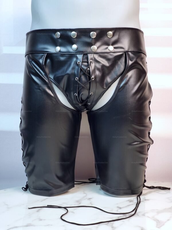Black faux leather chap shorts with adjustable waist and lace-up details.