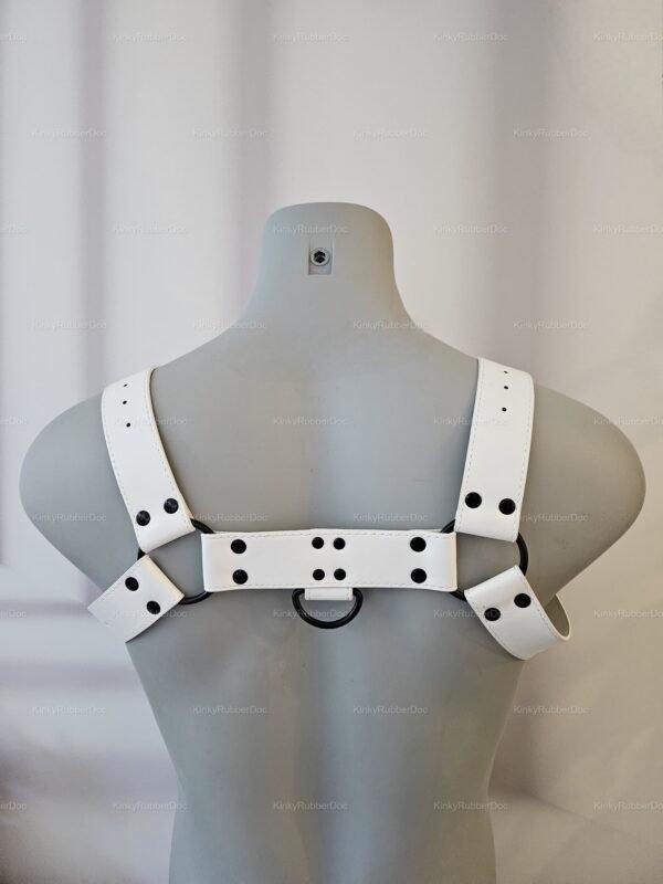 White PU leather harness with adjustable straps and black metal accents, designed for edgy and bold styling.