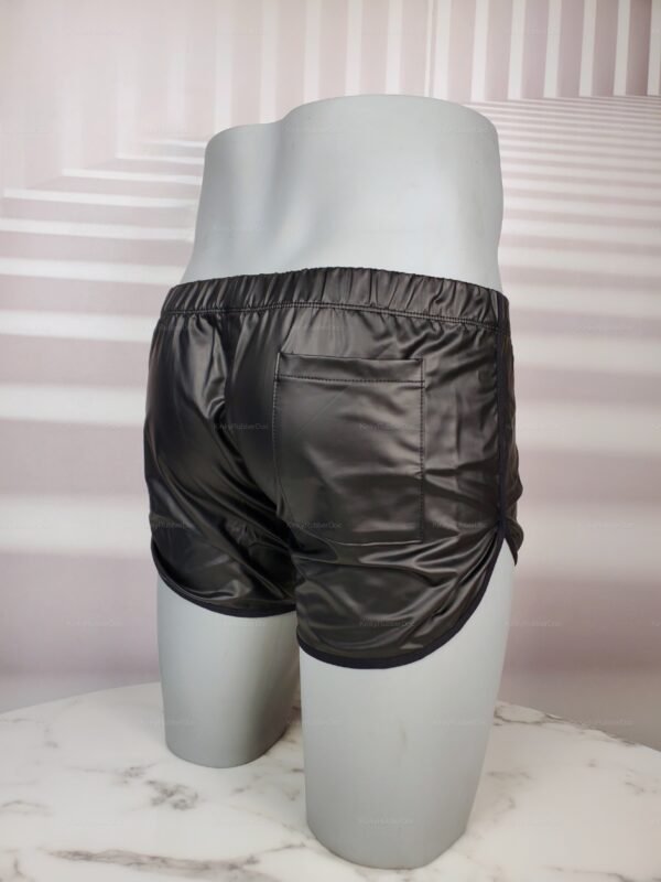 Sleek black leather-look shorts with bandage waist design.