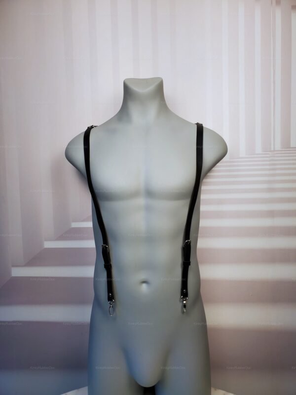 Black faux leather harness with adjustable straps and metal accents.