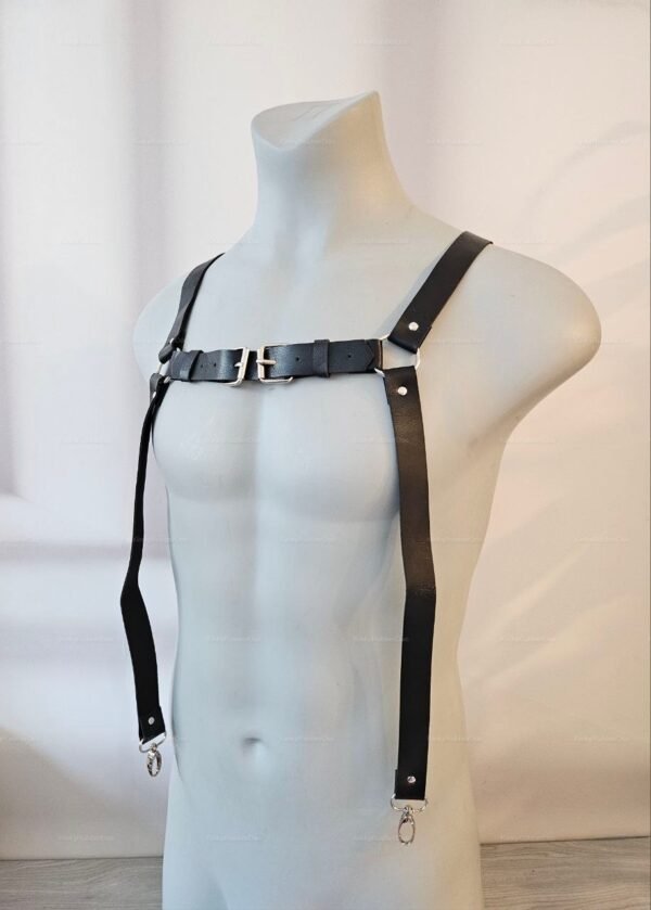Black faux leather harness with adjustable buckles and suspenders for a bold statement.