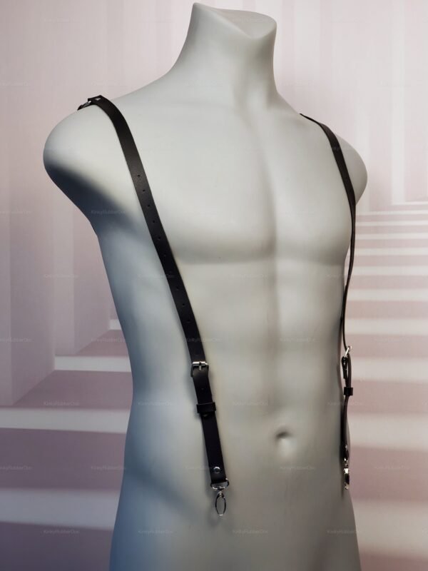 Sleek black faux leather X-back harness with adjustable straps and metal accents.