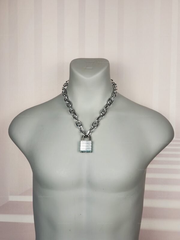 Bold chain necklace with a security lock in a metallic finish.