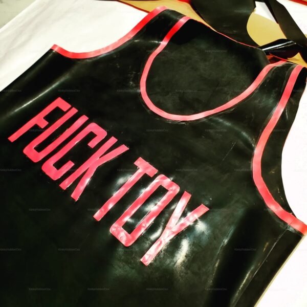 Black latex shirt with bold pink lettering and trim.