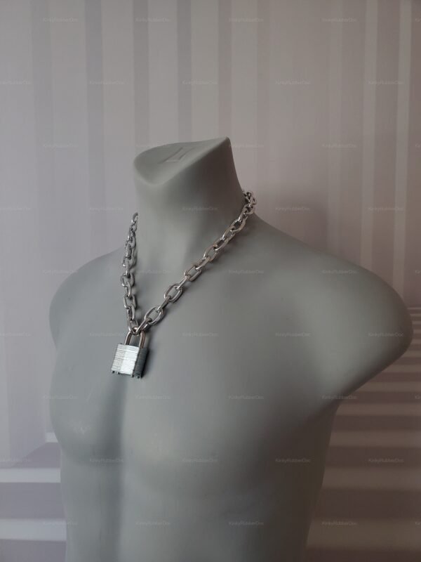 **Alt Text**: Chunky chain necklace with a double key lock in a metallic silver finish.