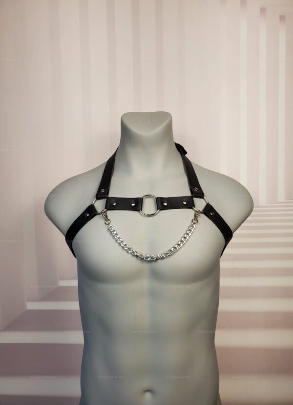 Leather harness with metal chain and O-ring detail for adult fashion.
