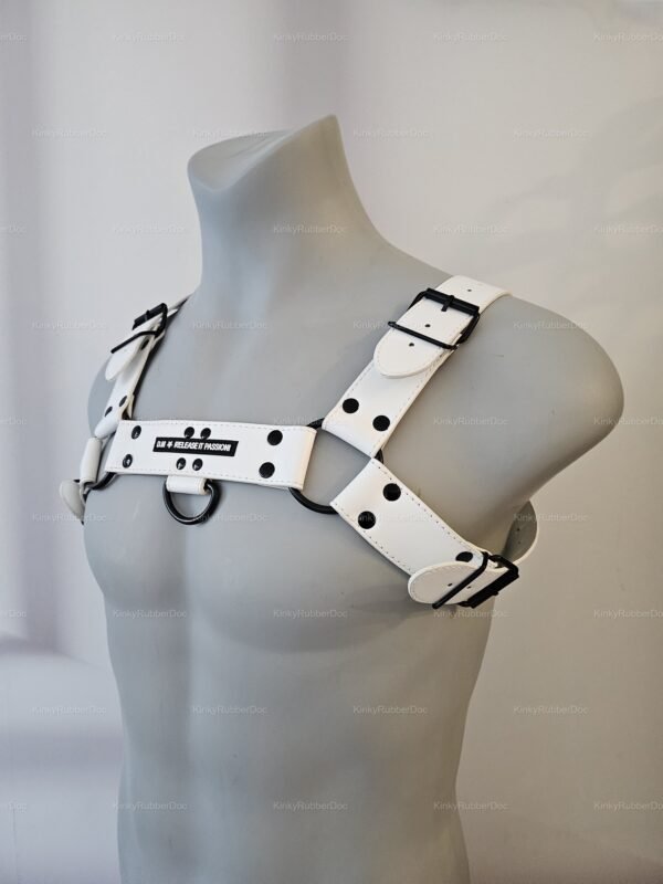 **Alt Text**: White body harness with black accents and adjustable buckles, designed for cosplay and fetish wear.