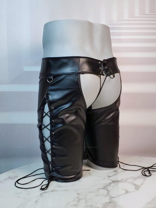 Faux leather chap shorts with metal snaps and lace-up sides for a bold, edgy look.