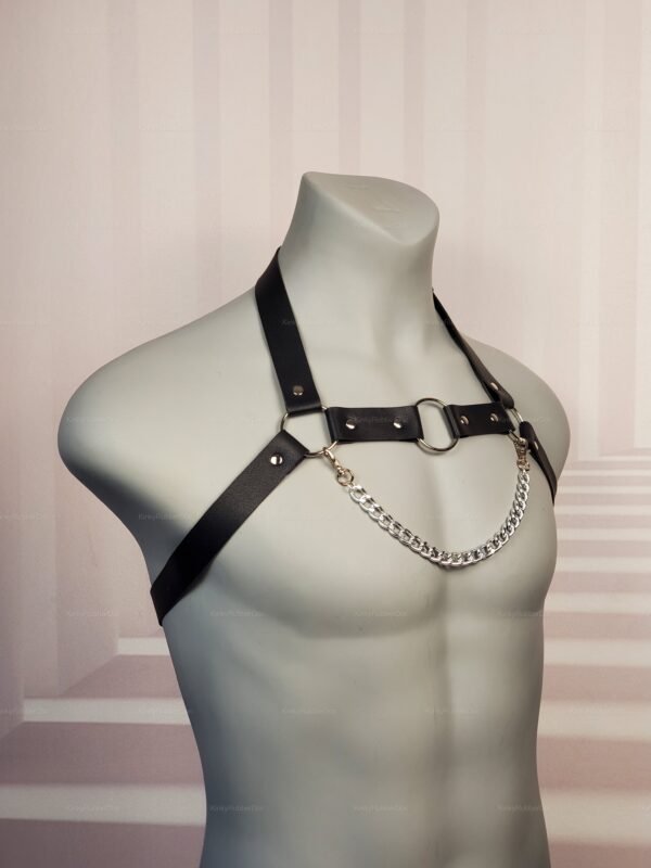 Black faux leather harness with silver chain detail.