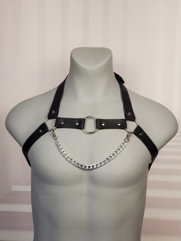 Faux leather harness with silver chain detailing for a bold, edgy look.