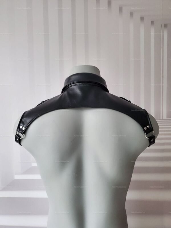Black faux leather shoulder harness with metal accents.