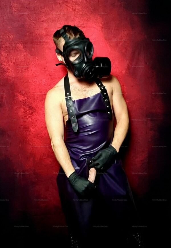 Dark purple latex apron with black straps and zip, paired with a gas mask for a bold fetish look.