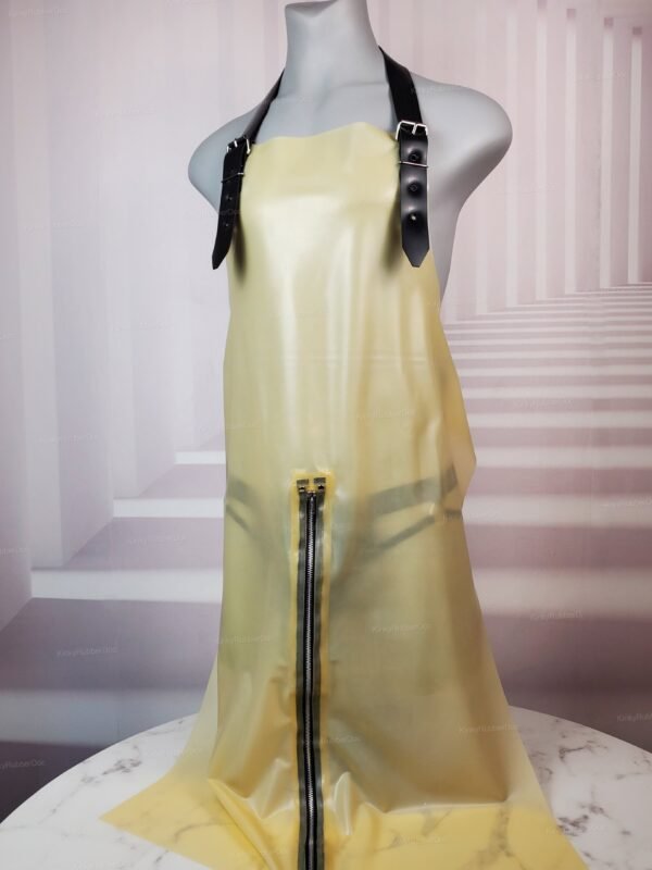 Transparent latex apron with black leather straps and central zipper.