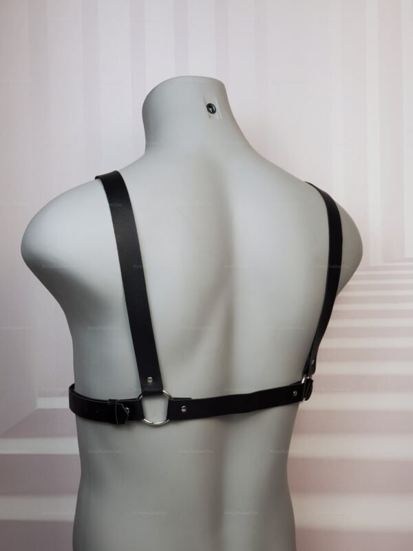 Minimalist black faux leather strap harness with O-ring, back close-up view on mannequin