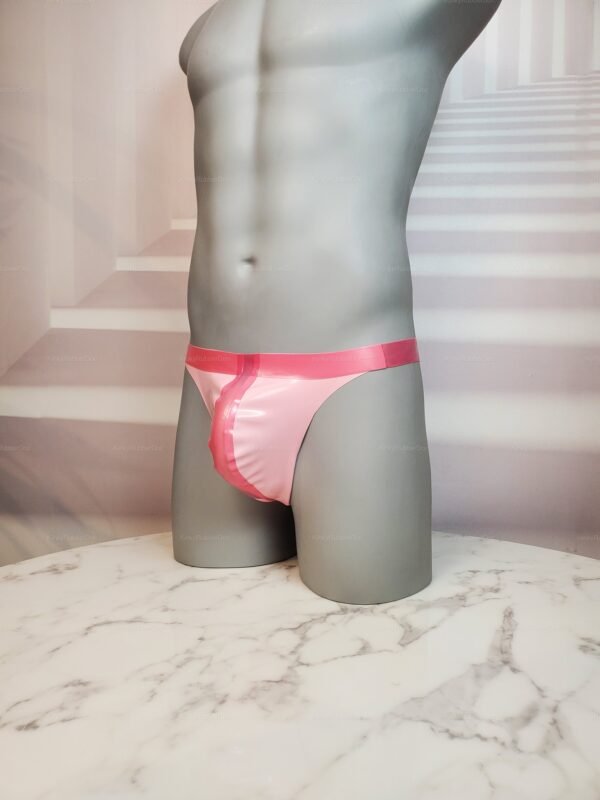Hot pink latex thong with a glossy finish, designed for bold clubwear and fetish fashion.