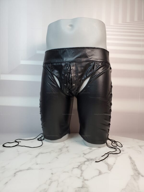 Black faux leather chap shorts with lace-up details for a bold and daring look.