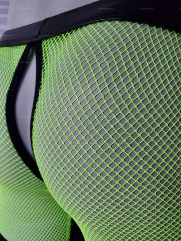 Close-up of neon green mesh shorts with a black waistband.