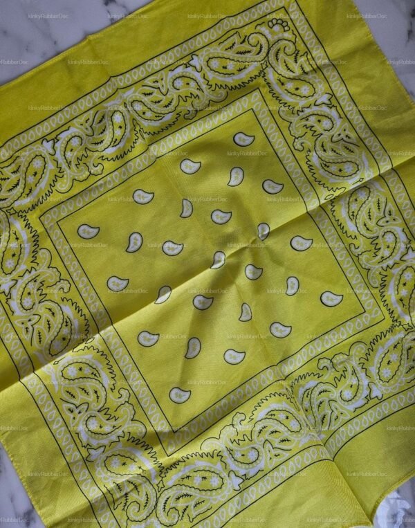Vibrant yellow handkerchief with intricate paisley patterns, ideal for expressing unique style in the kinky community.