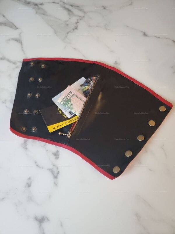Latex arm wallet with red trim and secure snap closures, featuring a discreet zipper pocket.