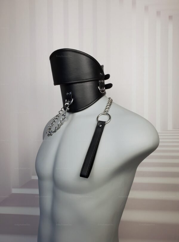 Black faux leather high posture collar with chain and leash attachment.